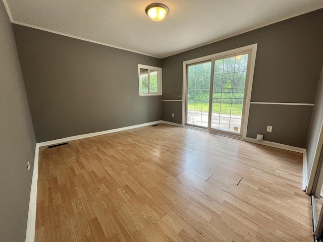 327 Somonauk St, Park Forest, IL 60466 - unfurnished room featuring light wood-style floors and ornamental molding