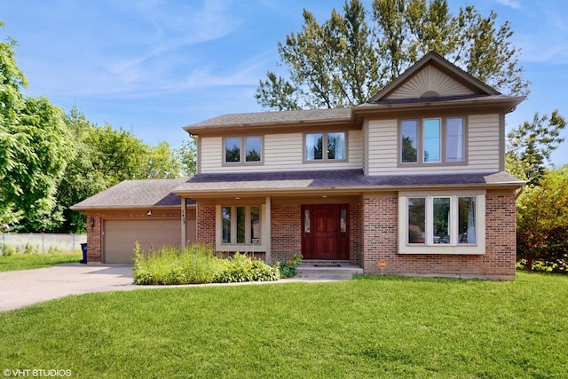 3425 Woodlawn Ave, Gurnee, IL 60031 - view of front of property with an attached garage, concrete driveway, a front yard, brick siding, and a shingled roof
