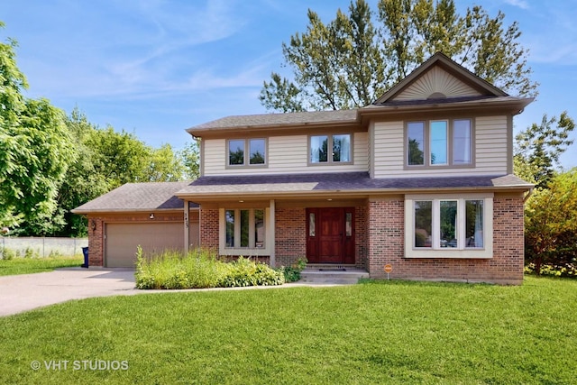 3425 Woodlawn Ave, Gurnee, IL 60031 - view of front of house with an attached garage, driveway, a front yard, and brick siding