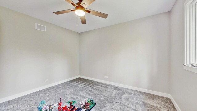 3425 Woodlawn Ave, Gurnee, IL 60031 - spare room featuring carpet flooring and ceiling fan