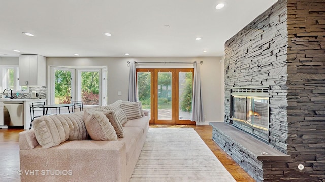 3425 Woodlawn Ave, Gurnee, IL 60031 - living area featuring recessed lighting, light wood finished floors, a fireplace, and french doors