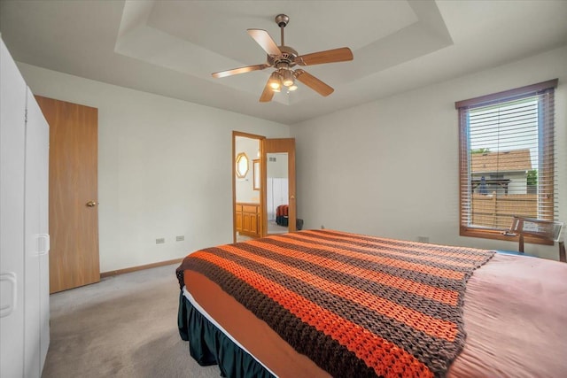 1801 Great Falls Dr, Plainfield, IL 60586 - bedroom with light carpet, a tray ceiling, ensuite bathroom, and ceiling fan