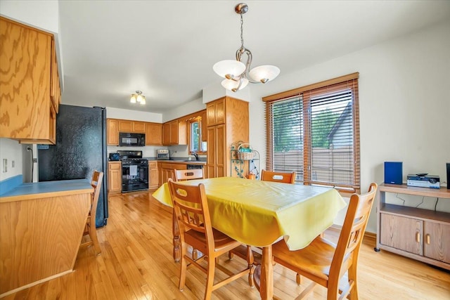 1801 Great Falls Dr, Plainfield, IL 60586 - dining space with a chandelier and light wood-style floors