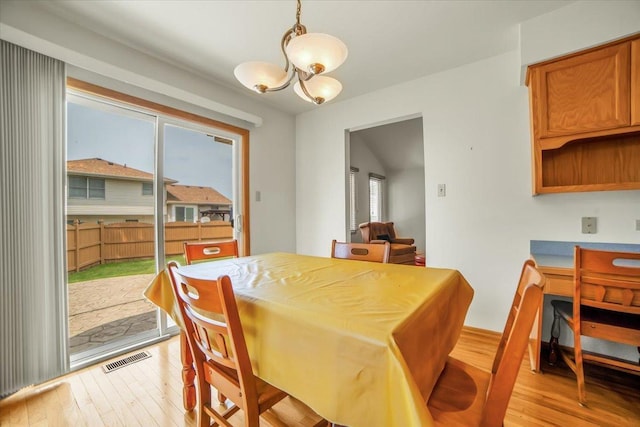 1801 Great Falls Dr, Plainfield, IL 60586 - dining room with a chandelier and light wood finished floors
