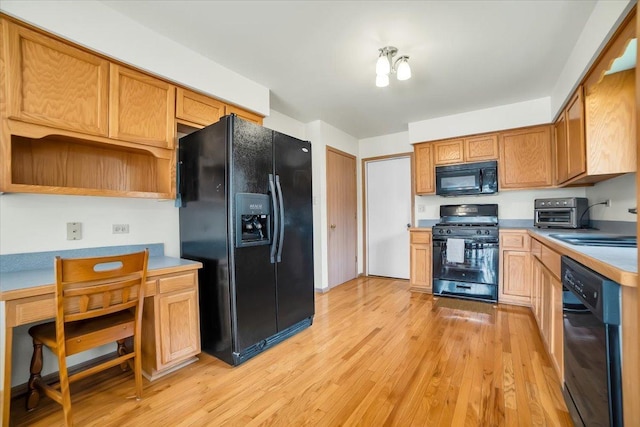 1801 Great Falls Dr, Plainfield, IL 60586 - kitchen featuring black appliances, a desk, light wood-style flooring, and light countertops