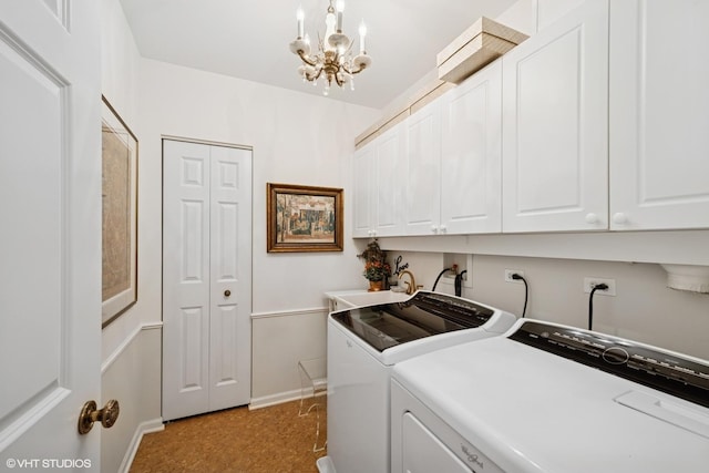 820 Weidner Rd Unit 409, Buffalo Grove, IL 60089 - laundry area featuring washer and clothes dryer, cabinet space, and a chandelier