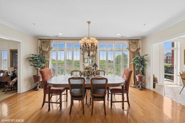 820 Weidner Rd Unit 409, Buffalo Grove, IL 60089 - dining space featuring crown molding, a chandelier, light wood finished floors, plenty of natural light, and recessed lighting