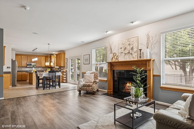 4345 Gladstone Dr, Lake In The Hills, IL 60156 - living area featuring a fireplace and light wood finished floors