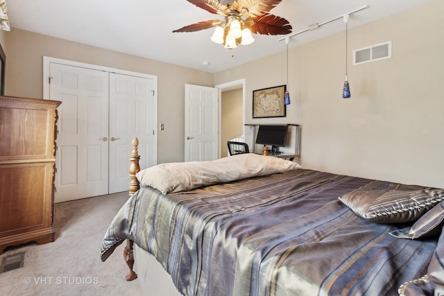 49W695 Hinckley Rd, Big Rock, IL 60511 - bedroom with light colored carpet, a closet, track lighting, and a ceiling fan