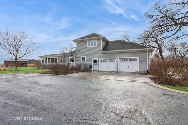 49W695 Hinckley Rd, Big Rock, IL 60511 - view of front of property featuring asphalt driveway, an attached garage, and roof with shingles