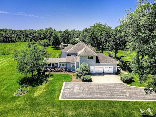49W695 Hinckley Rd, Big Rock, IL 60511 - view of front of property featuring an attached garage, driveway, and a front lawn