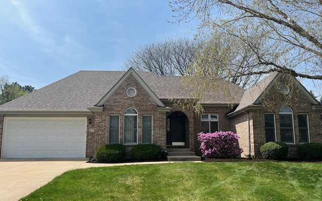 1779 Frost Ln, Naperville, IL 60564 - view of front of home with an attached garage, concrete driveway, brick siding, and a front lawn