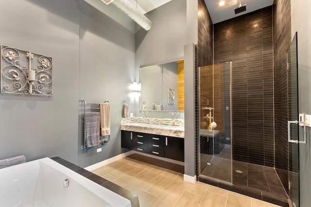 2411 W Walton St Unit 2B, Chicago, IL 60622 - bathroom with vanity, a bath, a shower stall, and a towering ceiling