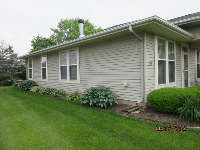13005 Big Horn Dr, Huntley, IL 60142 - view of side of home featuring a yard