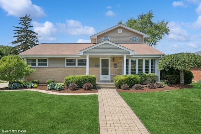 1419 W Miner St, Arlington Heights, IL 60005 - view of front of property with a front yard, brick siding, and a shingled roof