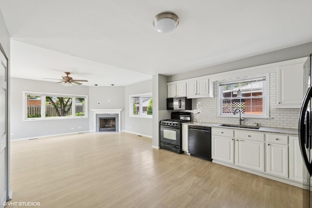 1419 W Miner St, Arlington Heights, IL 60005 - kitchen featuring black appliances, backsplash, light wood-type flooring, and a ceiling fan