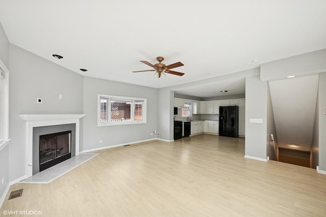 1419 W Miner St, Arlington Heights, IL 60005 - unfurnished living room featuring light wood-type flooring, ceiling fan, and a fireplace