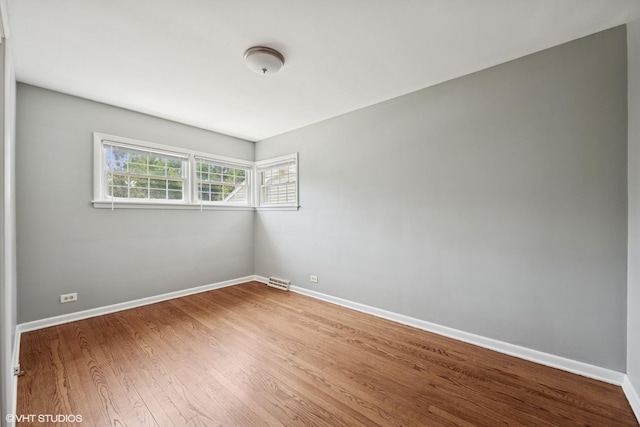 1419 W Miner St, Arlington Heights, IL 60005 - spare room with wood finished floors and baseboards