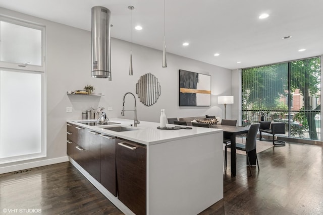 1718 W Le Moyne St Unit 1, Chicago, IL 60622 - kitchen with floor to ceiling windows, modern cabinets, dark wood-type flooring, recessed lighting, and light countertops
