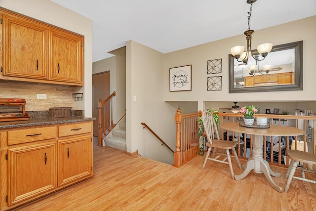 512 Creekside Cir, Minooka, IL 60447 - dining space with light wood finished floors and a chandelier