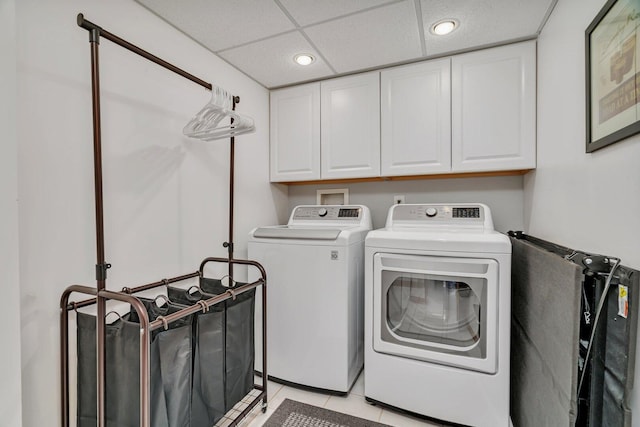 512 Creekside Cir, Minooka, IL 60447 - washroom with washing machine and dryer, cabinet space, recessed lighting, and light tile patterned floors