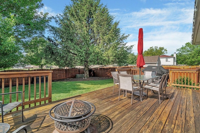 512 Creekside Cir, Minooka, IL 60447 - wooden deck with an outdoor fire pit, a fenced backyard, outdoor dining space, and grilling area