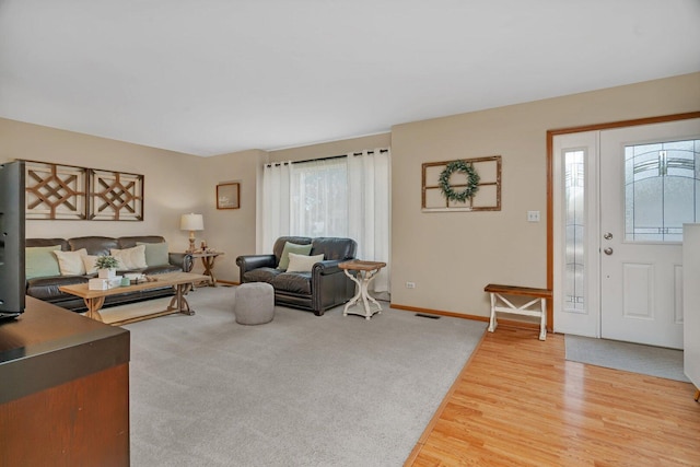 512 Creekside Cir, Minooka, IL 60447 - living room with light wood-type flooring and baseboards