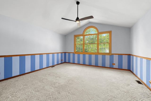 314 Spring Creek Cir, Schaumburg, IL 60173 - spare room featuring carpet flooring, vaulted ceiling, a ceiling fan, and wallpapered walls