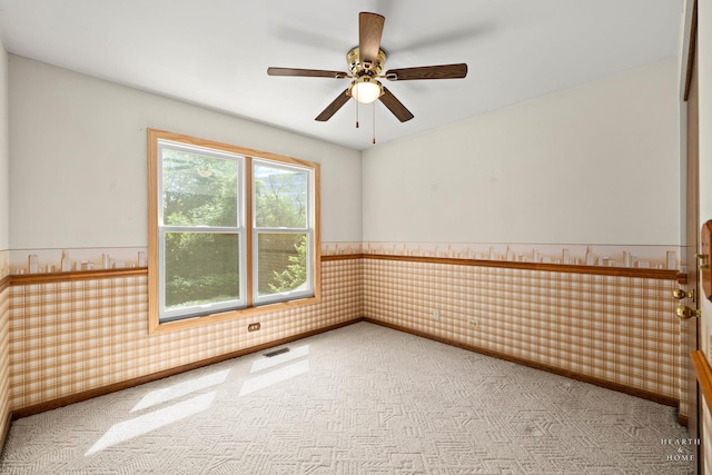 314 Spring Creek Cir, Schaumburg, IL 60173 - empty room with wainscoting, carpet flooring, and a ceiling fan