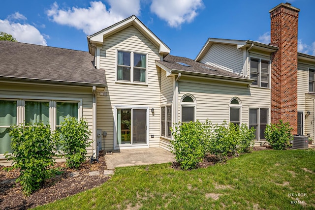 314 Spring Creek Cir, Schaumburg, IL 60173 - back of house with a yard, a patio, a chimney, and a shingled roof