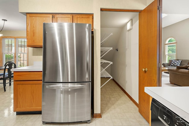 314 Spring Creek Cir, Schaumburg, IL 60173 - kitchen with freestanding refrigerator, light countertops, light flooring, dishwashing machine, and brown cabinetry
