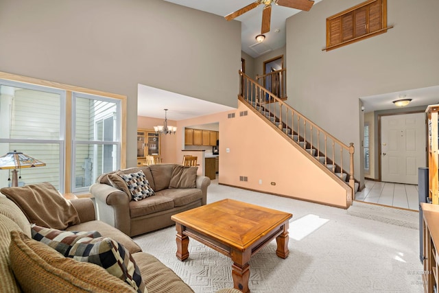 314 Spring Creek Cir, Schaumburg, IL 60173 - living room featuring stairway, a towering ceiling, a chandelier, light colored carpet, and ceiling fan
