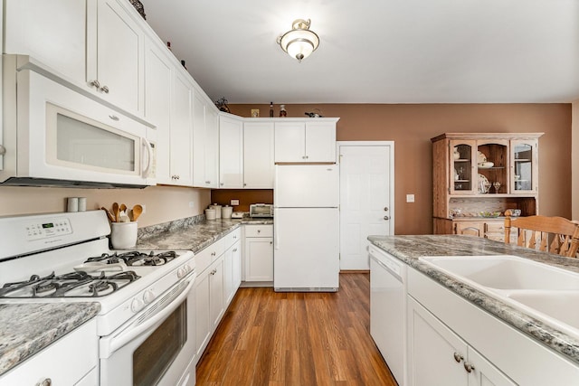 4115 Dalewood Dr, Plainfield, IL 60586 - kitchen featuring white appliances, light wood-style floors, white cabinetry, and light countertops