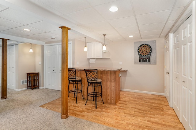 4115 Dalewood Dr, Plainfield, IL 60586 - indoor bar featuring a drop ceiling, recessed lighting, hanging light fixtures, and light wood-type flooring