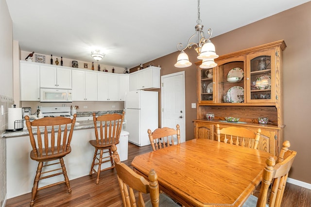 4115 Dalewood Dr, Plainfield, IL 60586 - dining space featuring dark wood finished floors and a chandelier