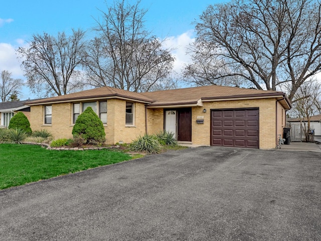 12801 W Playfield Dr, Crestwood, IL 60418 - ranch-style house with a garage, brick siding, asphalt driveway, and a front yard