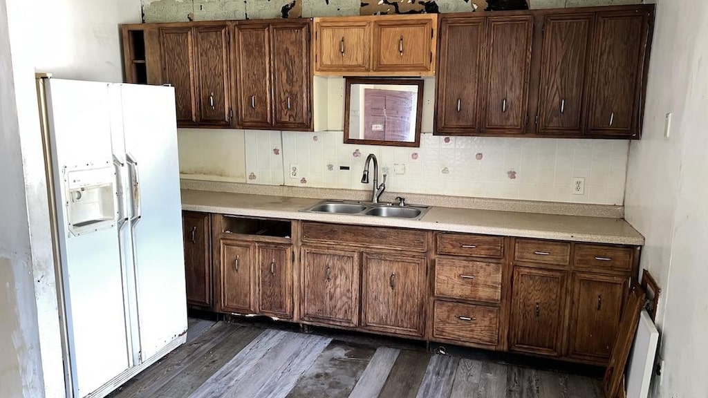 128 S Scottswood Dr, Urbana, IL 61802 - kitchen with white fridge with ice dispenser, dark wood-type flooring, tasteful backsplash, and light countertops