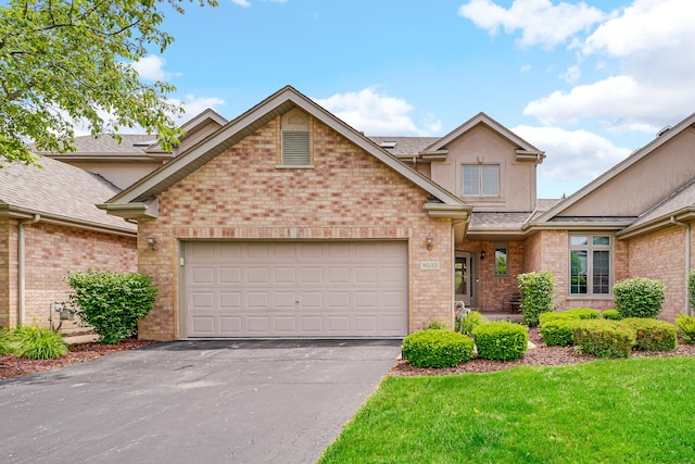8033 Nielsen Dr, Tinley Park, IL 60477 - view of front of home featuring driveway, brick siding, an attached garage, and a front yard