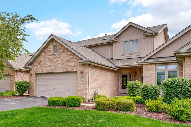 8033 Nielsen Dr, Tinley Park, IL 60477 - view of front of property with roof with shingles, brick siding, a garage, and asphalt driveway