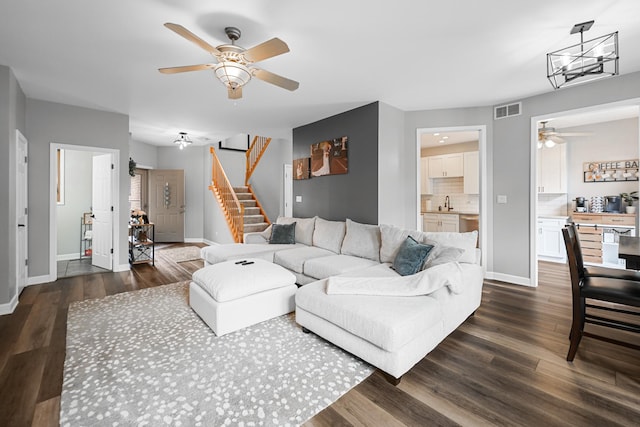 8033 Nielsen Dr, Tinley Park, IL 60477 - living room with a ceiling fan, stairs, dark wood-type flooring, and a chandelier