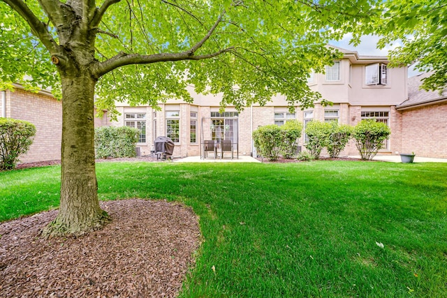 8033 Nielsen Dr, Tinley Park, IL 60477 - view of grassy yard with a patio