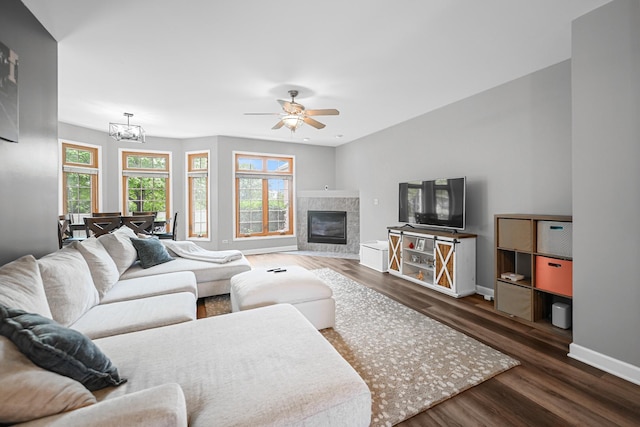 8033 Nielsen Dr, Tinley Park, IL 60477 - living area featuring wood finished floors, ceiling fan, a chandelier, and a fireplace