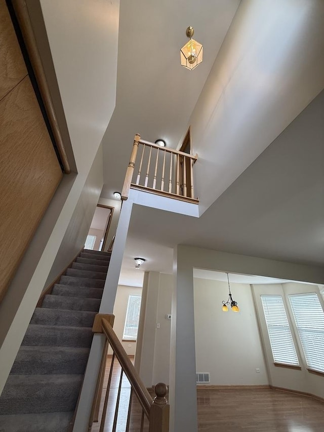710 Silver Leaf Ct, Joliet, IL 60431 - staircase with wood finished floors and a towering ceiling