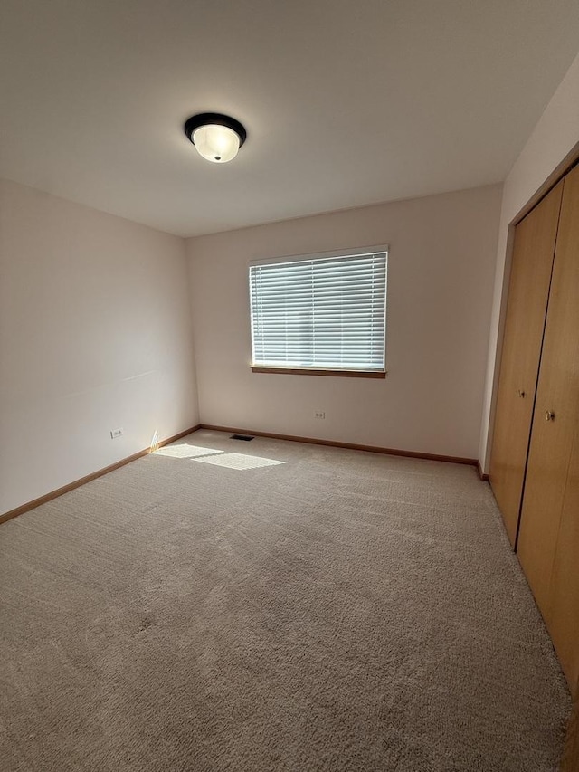 710 Silver Leaf Ct, Joliet, IL 60431 - unfurnished bedroom with a closet and light colored carpet