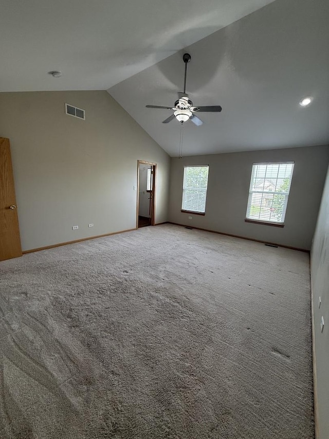 710 Silver Leaf Ct, Joliet, IL 60431 - spare room with vaulted ceiling, ceiling fan, and light colored carpet
