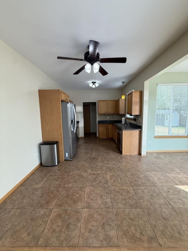 710 Silver Leaf Ct, Joliet, IL 60431 - kitchen with stainless steel fridge with ice dispenser, dark countertops, ceiling fan, and tile patterned flooring