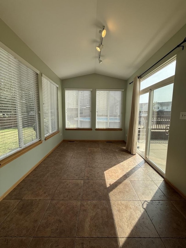 710 Silver Leaf Ct, Joliet, IL 60431 - unfurnished sunroom with lofted ceiling, track lighting, and healthy amount of natural light