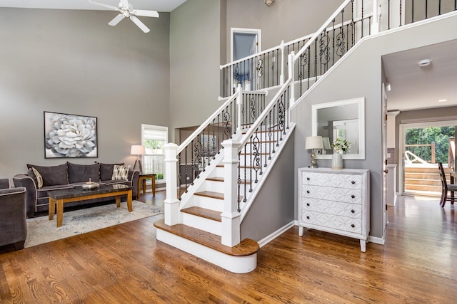 923 Christa Ct, Elk Grove Village, IL 60007 - stairs with wood finished floors, ceiling fan, and a towering ceiling