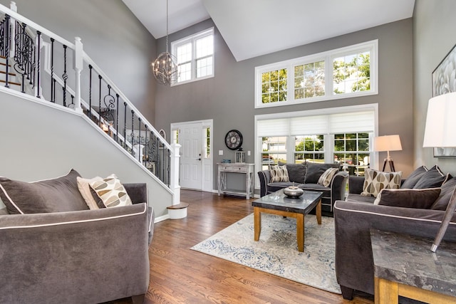 923 Christa Ct, Elk Grove Village, IL 60007 - living room with high vaulted ceiling, stairway, a chandelier, and wood finished floors
