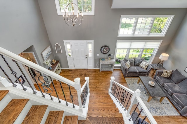 923 Christa Ct, Elk Grove Village, IL 60007 - foyer with a towering ceiling, a chandelier, stairway, and wood finished floors